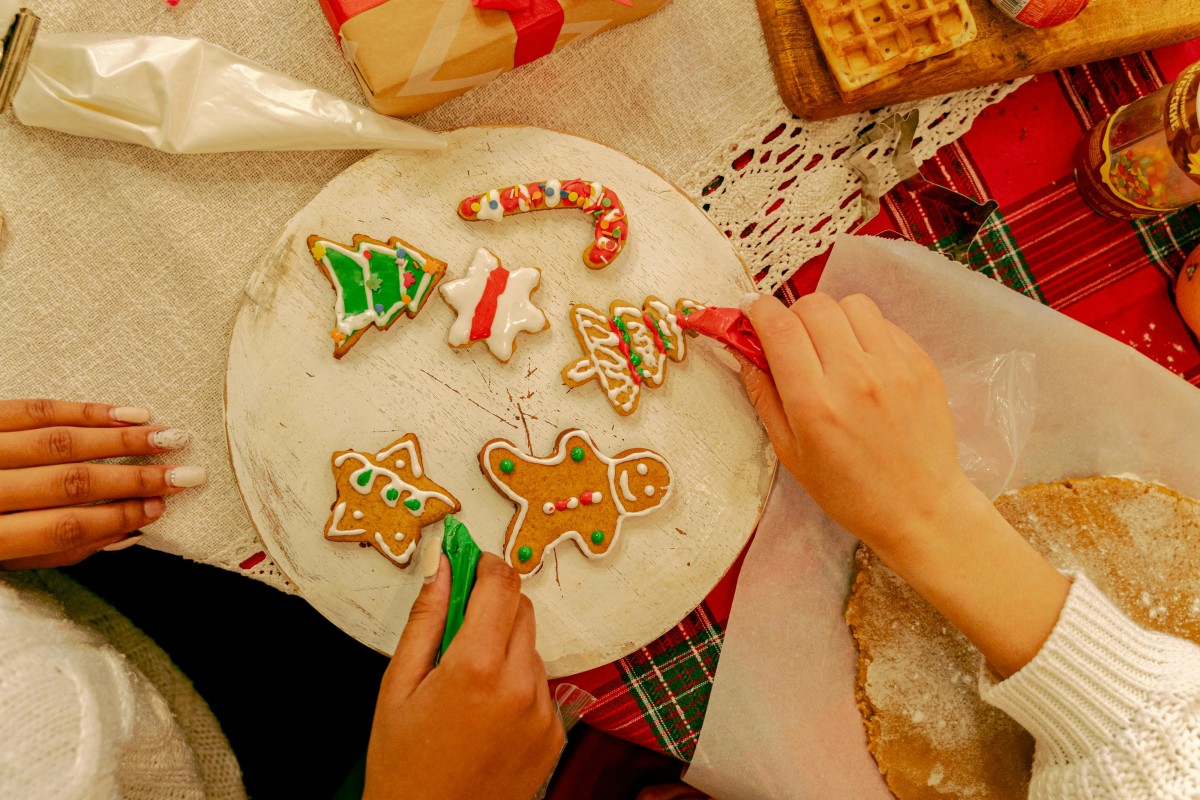 People Decorating a Gingerbreads